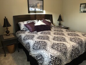 King size bed with new soft shag carpeting.