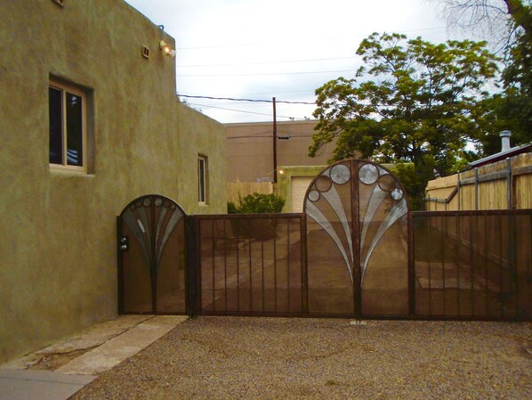  Art deco front gate to enclose full yard for pets , kids and car .