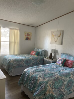 Two separate bedrooms with (2) double beds each. Roomy, cool and comfy!