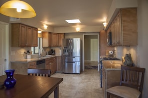 Well-appointed kitchen with all the necessary implements for a fantastic meal.