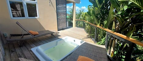 Enjoy the view from the outside whirlpool tub on your private sun deck