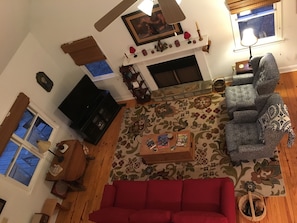 View of living room looking down from loft