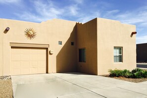 Enclosed one-car garage with garage door opener.