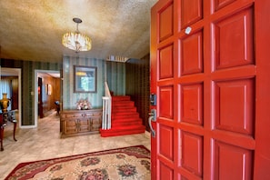 Enter the welcoming foyer from the front porch / double doors.