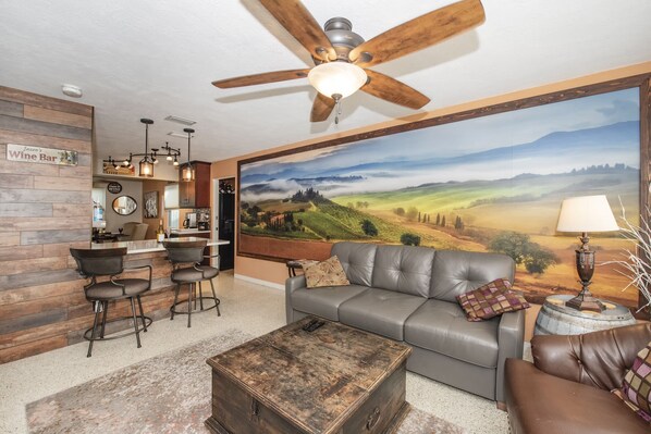 An open floor plan that brings the living room, kitchen & dining room together.