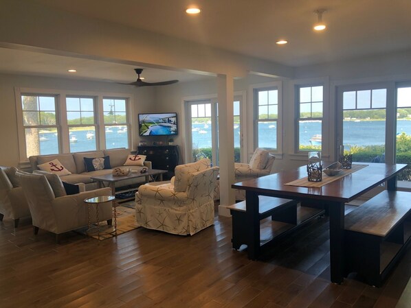 1st floor living room open to dining room, kitchen and sunroom