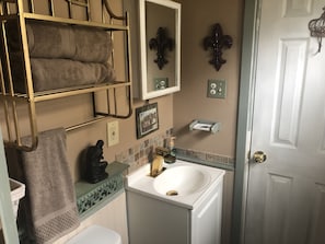 Bathroom with shower and modern gold fixtures