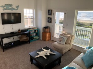 Upstairs living room opens onto the ocean front balcony with amazing views 