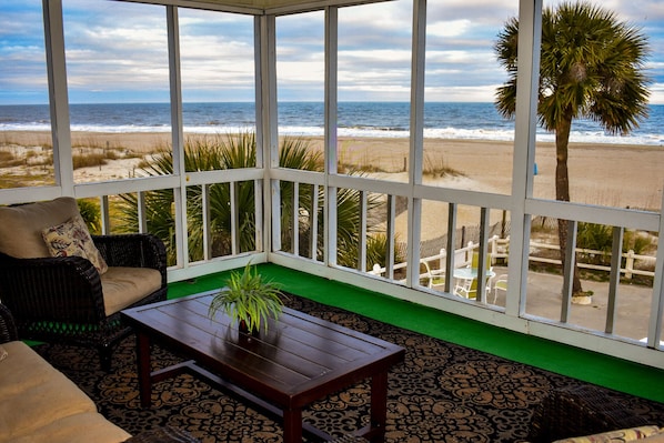 view from sitting area of huge screened porch