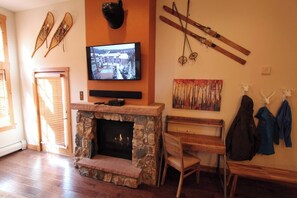 Sit at desk and warm yourself by the fire