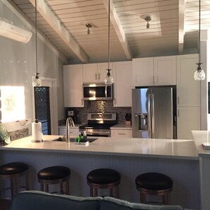 Newly remodeled kitchen with bar seating.