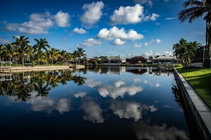 Beautiful, wide canal with palm trees in the southwest