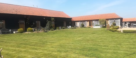 Front view of the Hay Barn, Barley Barn and Cart Lodge .