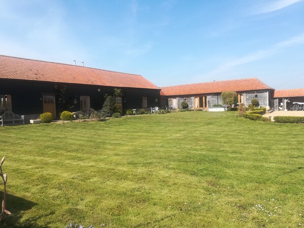 Front view of the Hay Barn, Barley Barn and Cart Lodge .