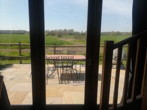 View through the Barley Barn back doors.  Private patio overlooking farmland.
