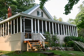 Wrap around porch and flower bed.