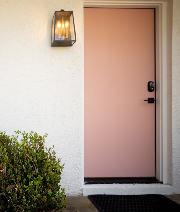 You unit door with room sign. Be aware, all doors are pink.