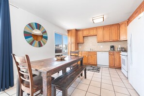 The kitchen opens out to the dining area, making meal prep a social affair!
                