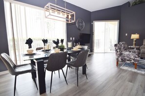 Beautiful formal dining area with views to the pool deck