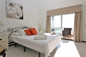 Master bedroom with king size bed, air conditioning and terrace with seaviews