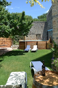 Holidays in Lagrasse. Stunning medieval apartment set in walled garden with pool