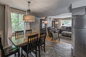 View of Dining area looking into living area towards bay window.