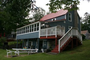 Screened in porch opens to deck.