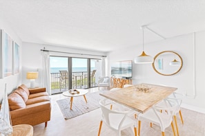 Bright and airy living space featuring elegant furnishings and ocean views.