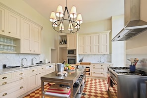 The kitchen is equipped to serve large groups or intimate gatherings.