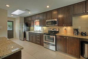 Fully stocked kitchen, granite and stainless. 