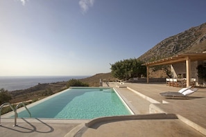 Pool, view and villa

