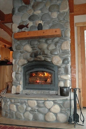 A river rock fireplace for your enjoyment.