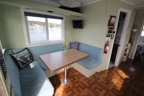 Salon table drops and converts to a queen bed.