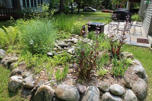 Pond and back patio. Grill and fire table ready!