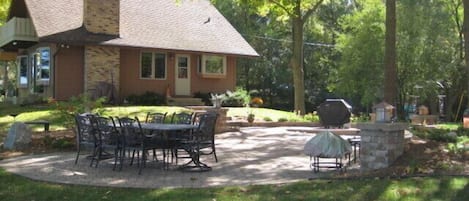 Large patio with a table for 8, bbq, and fire pit for unlimited entertainment.
