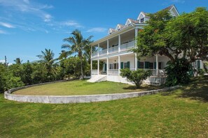 Wrap around verandas with harbor views overlooking the large lawns