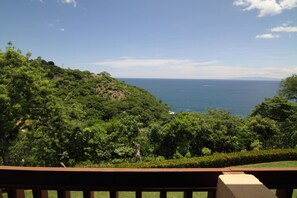 Looking west from the master bedroom balcony. We see Whale, Dolphin, and boats.