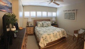 Bedroom with queen bed, 32" TV, ceiling fan or A/C.  05/2024