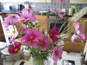 Fresh flowers from the garden in nearly every room of the cottage