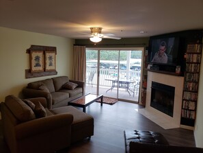 Another view of living room.  55 inch TV/DVD, lots of movies, balcony access