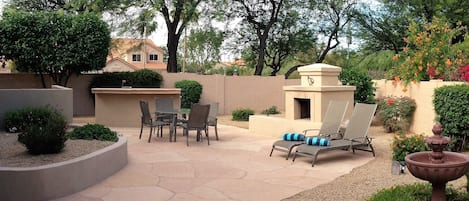 Your large private Flagstone Patio with new water feature, Kiva and built in BBQ