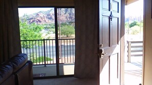 Entrance and Sliding Glass Door to Balcony and the Red Rock Views
