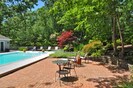 Expansive Private Views of Pool, Trees and Colorful Gardens