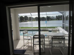 Lounge with pool and lake view.