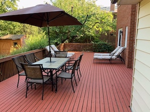 Huge 16' X 42' deck in backyard with outdoor  lounge and dining furniture