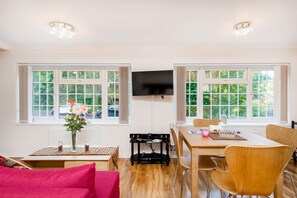 32' SMART TV with Sky Satellite TV (including sports), coffee table and dining table.
