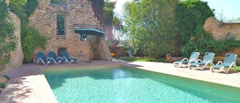 The large swimming pool is shared with two other holiday homes