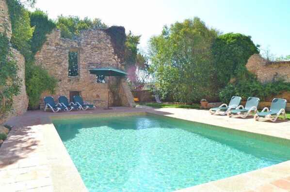 The large swimming pool is shared with two other holiday homes