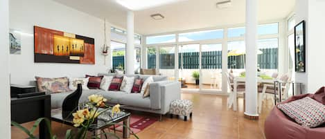 It is a  beautiful and comfortable fully glassed patio personally decoreted. 