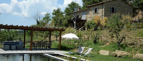 Casa dell'Ortolano (the Garden House) and its new bio-pool (added in 2019)